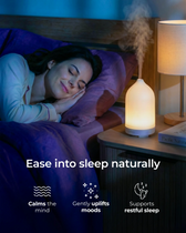  sleeping in bed with a diffuser on a nightstand